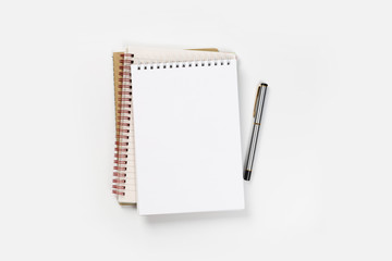 school notebook on a white background, spiral notepad on a table.