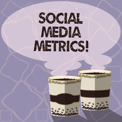 Handwriting text writing Social Media Metrics. Concept meaning Benchmarks that determine how well the campaign working Two To Go Cup with Beverage and Steam icon Blank Speech Bubble photo