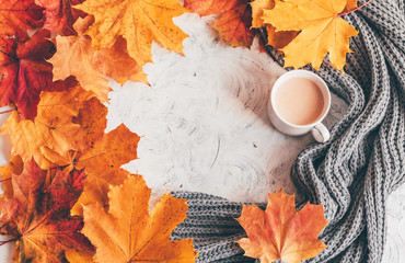Fotomurales - Autumn home cozy composition a cup of coffee with maple leaves.Top view