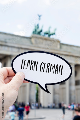 Foto text learn german in front of the Brandenburg Gate