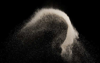 Fine sand white splash explosion isolated on black background ,launch freeze stop motion object design