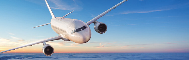 Wall Mural - passengers commercial airplane flying above clouds
