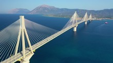 Aerial Drone Video Of World Famous Cable Suspension Bridge Of Rio - Antirio Harilaos Trikoupis, Crossing Corinthian Gulf, Mainland Greece To Peloponnese, Patras