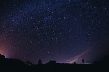 Wall Mural - landscape night sky stars milky way on mountains background