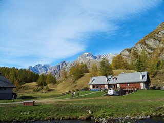 Wall Mural - A mountain pasture with its typical houses immersed in the Nature of the Natural Park 