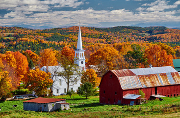 Wall Mural - Congregational Church and farm with red barn at sunny autumn day in Peacham, Vermont, USA