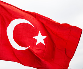 Wall Mural - Flag of Turkey waving in the wind with highly detailed fabric texture