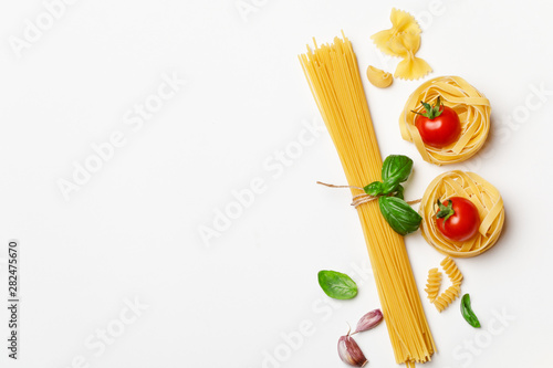 Fotografía Various uncooked pasta on white background