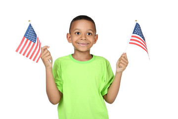 Cute boy with american flags on white background