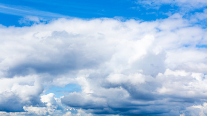 Wall Mural - low cumulus white clouds in blue sky on summer day