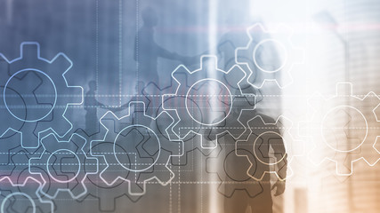 Wall Mural - double exposure gears mechanism on blurred background. business and industrial process automation co