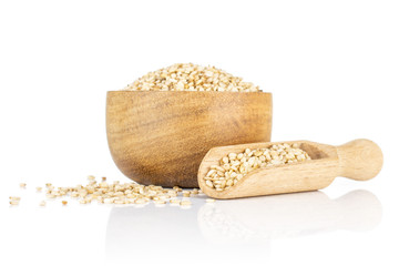 Wall Mural - Lot of whole unpeeled sesame seeds in wooden bowl with wooden scoop isolated on white background