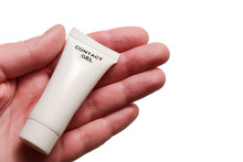 A Tube Of Contact Gel In The Palm Of Hand. Isolated On White Background.