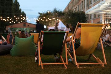 Modern open air cinema with comfortable seats in public park