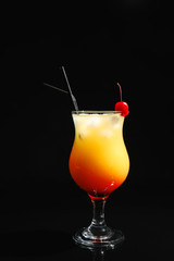 Glass of cocktail Sex on the Beach, black background