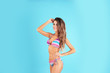 © New Africa - Pretty sexy woman with beautiful slim body in stylish bikini on color background