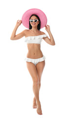 Canvas Print - Beautiful young woman in stylish bikini with hat on white background