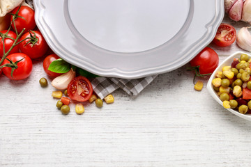 Canvas Print - Empty plate and various vegetables around