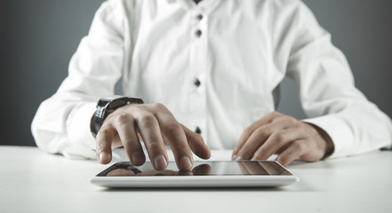 Man using digital tablet. Technology