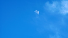 Moon On A Blue Sky Day
