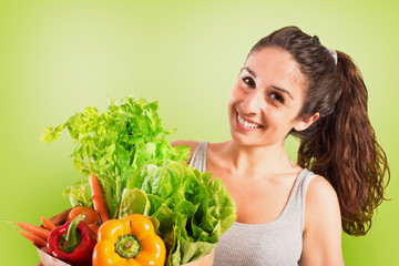 Beautiful girl with vegetables in the bag. Green style