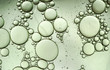 Abstract macro shot of oil drops on water