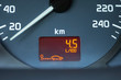 On-board computer of a car shows a low petroleum consumption. The figures on the dashboard show the fuel consumption of 4.5 liters per 100 kilometers