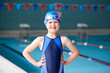 © Monkey Business - Portrait Of Girl Standing By Edge Of Swimming Pool Ready For Lesson