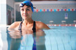 © Monkey Business - Female Swimmer Wearing Hat And Goggles Training In Swimming Pool