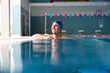 © Monkey Business - Male Swimmer Wearing Hat And Goggles Training In Swimming Pool