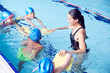 © Monkey Business - Female Coach In Water Giving Group Of Children Swimming Lesson In Indoor Pool