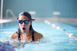 © Monkey Business - Female Swimmer Wearing Goggles Training In Swimming Pool