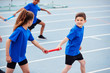 © Monkey Business - Children In Athletics Team Competing In Relay Race On Sports Day