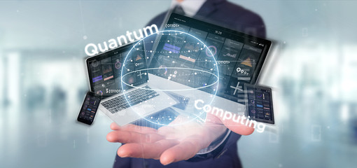 Wall Mural - businessman holding quantum computing concept with qubit and devices 3d rendering