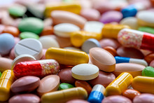 Close Up Of Variety Of Colorful Pills, Capsules, And Tablets