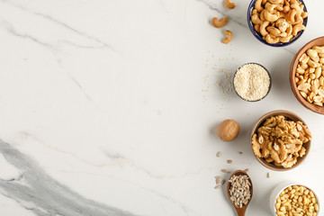 Wall Mural - Frame made of different types of nuts in bowls