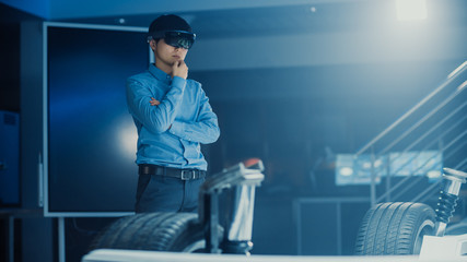Poster - Automotive Engineer Working on Electric Car Chassis Platform, Using Augmented Reality Headset. In Innovation Laboratory Facility Concept Vehicle Frame Includes Wheels, Suspension, Engine and Battery.
