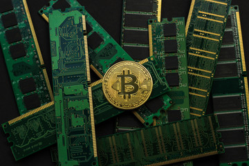 Wall Mural - Bitcoin on background of hardware. Memory strip. Top view, flat lay 