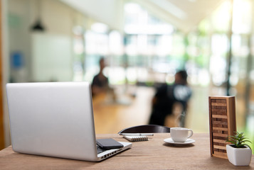 .Desk Workplace with a comfortable work table in the background that is used