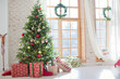 © aprilante - Christmas tree and gift boxes near the window