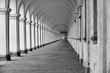 Black and white photo of historical colonade with column infinity efect, Kromeriz, Czech Republic