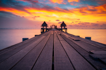 Wooded bridge in the port and sunset