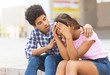 © Prostock-studio - Young guy comforting his sad girlfriend that crying on public