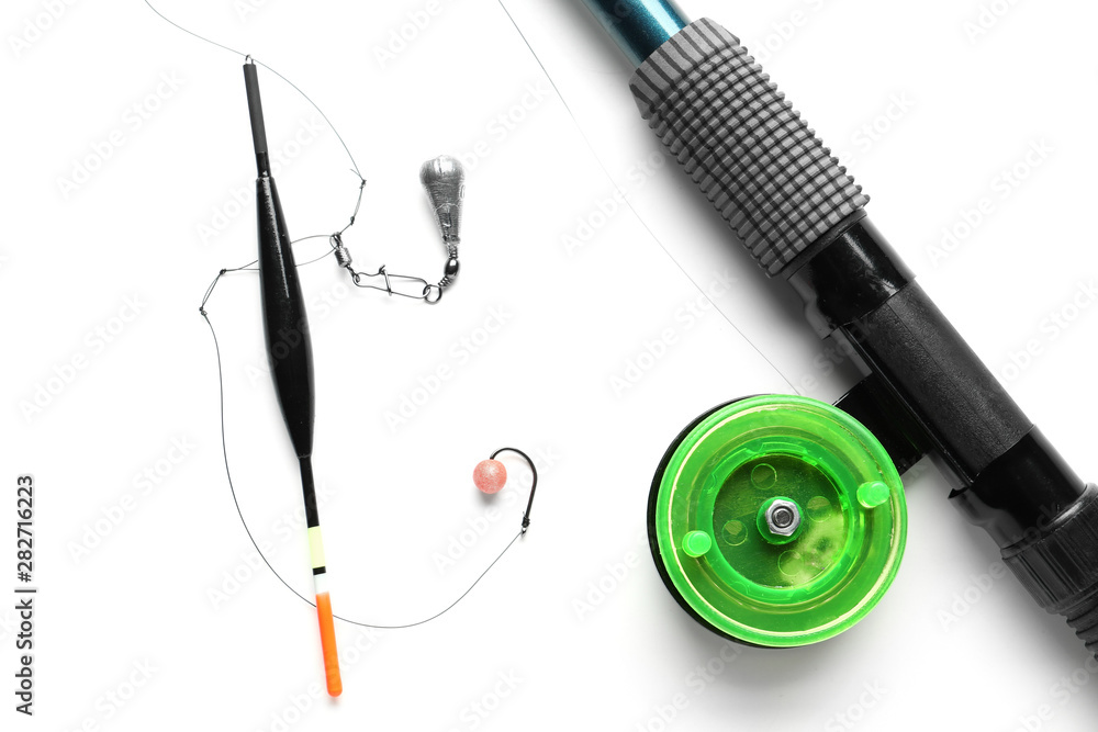 Fishing tackle and tools on white background
