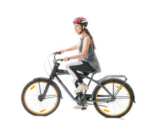 Sporty Young Woman Riding Bicycle Against White Background