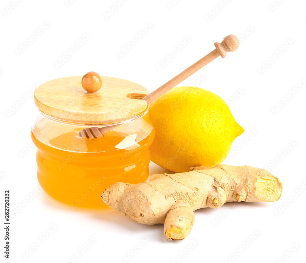 Jar of fresh honey, lemon and ginger on white background