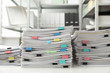 © New Africa - Stacks of documents with paper clips on office desk