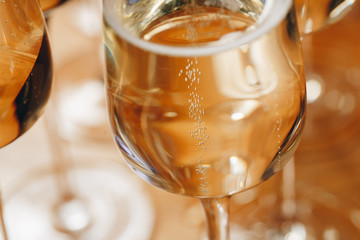 Wall Mural - Champagne glasses on table closeup.