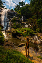 Woman Admires Wachirathan Waterfall In Doi Inthanon National Park Near Chiang Mai Thailand