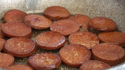 Wall Mural - cooked sausages in a pan on the table,